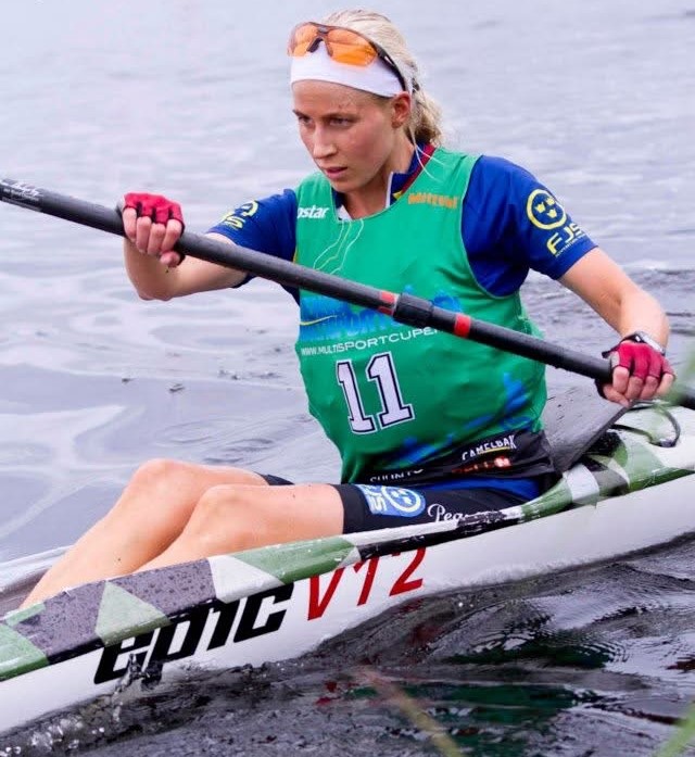KRISTIN LARsson paddling a surfski kayak in a multisport race