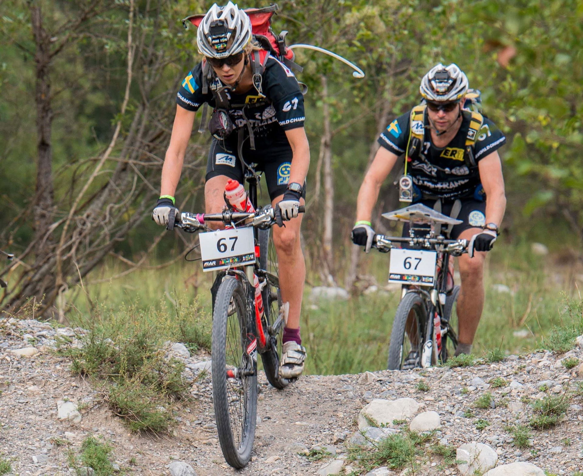 KRISTIN LARsson mountain biking on a rocky trail during a multisport race